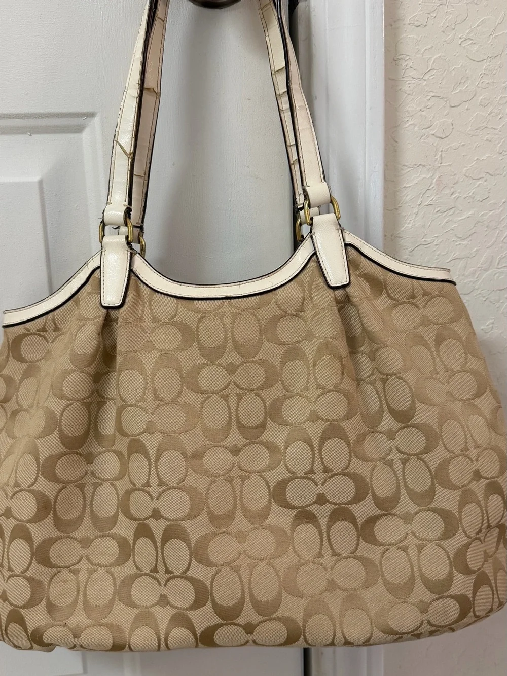 Coach Signature Canvas Beige Tote Bag with Ivory Trim handles are cracked!